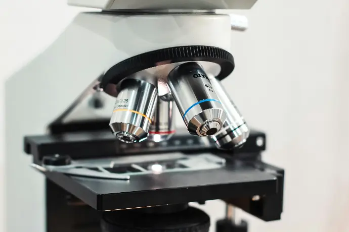 a close up of a microscope on a table